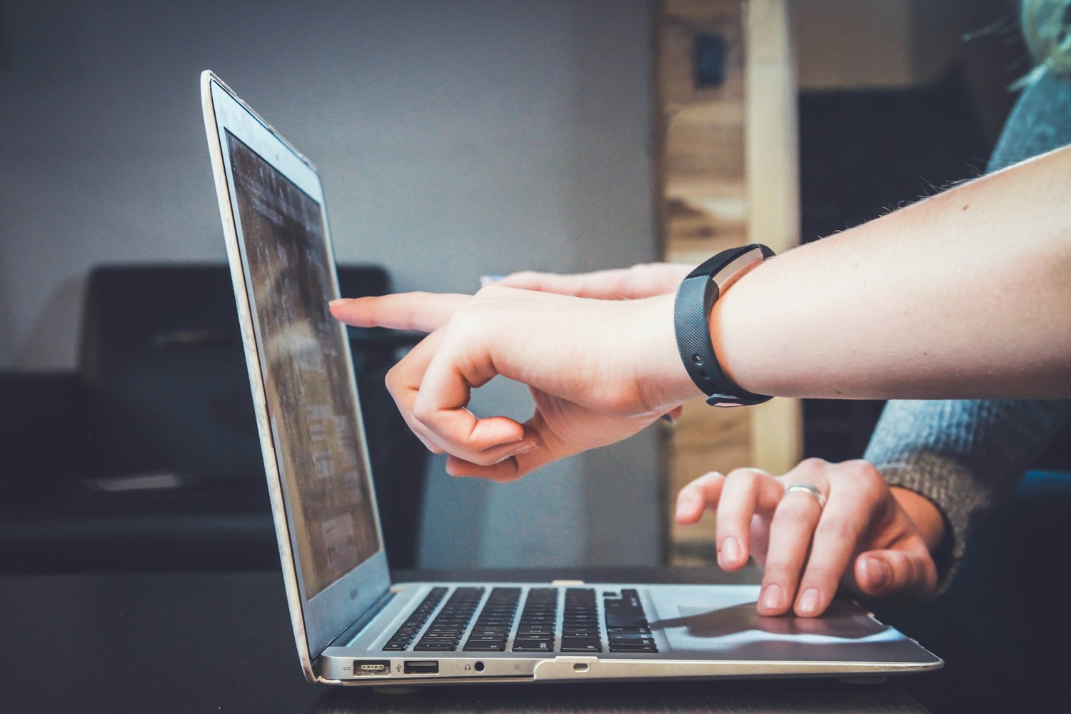 People reviewing a laptop together